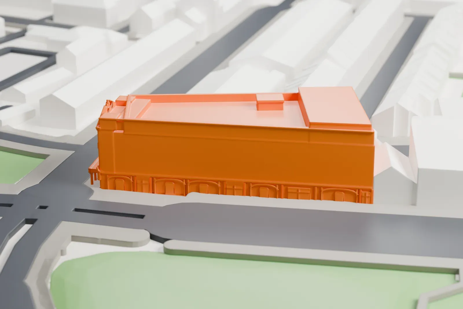 A white 3D print of the Old Vic, a low playhouse, standing among the surrounding city buildings.