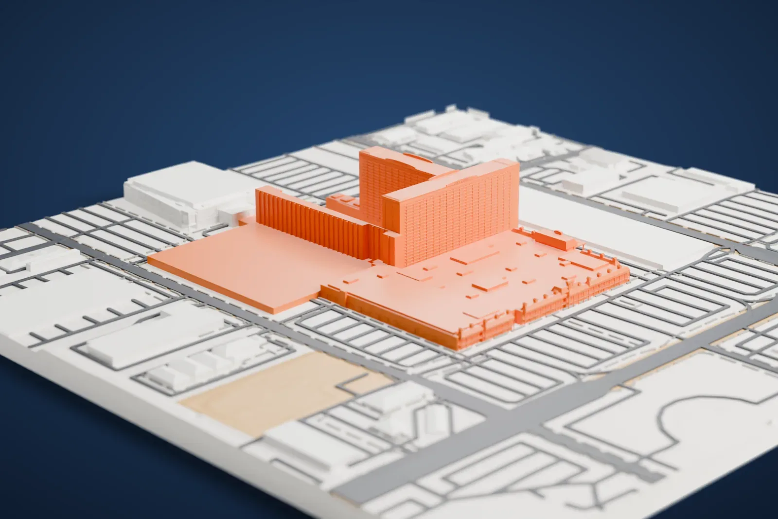 A white 3D print of The Orleans, a wide, low hotel and casino complex with a taller hotel block, set among parking lots, roads and nearby buildings.