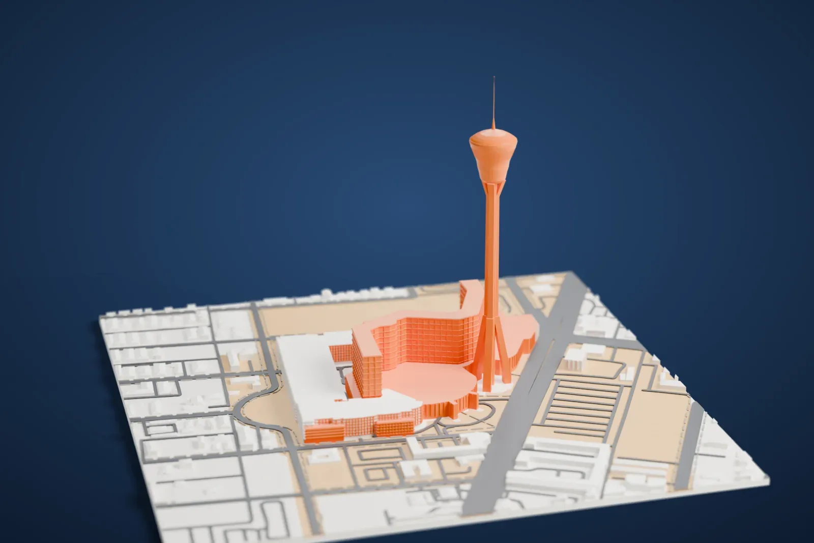 A white 3D print of The Strat, a very tall slender tower with a wide pod near the top and a thin antenna, rising from a cluster of large buildings with streets and flat lots around it.