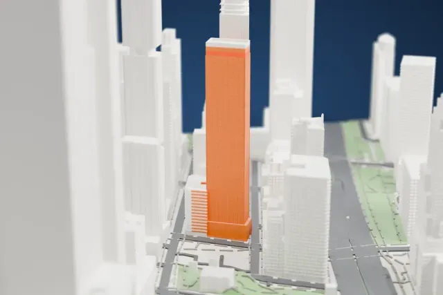 A white 3D print of the The Washington New York City model in New York, with the streets around it.