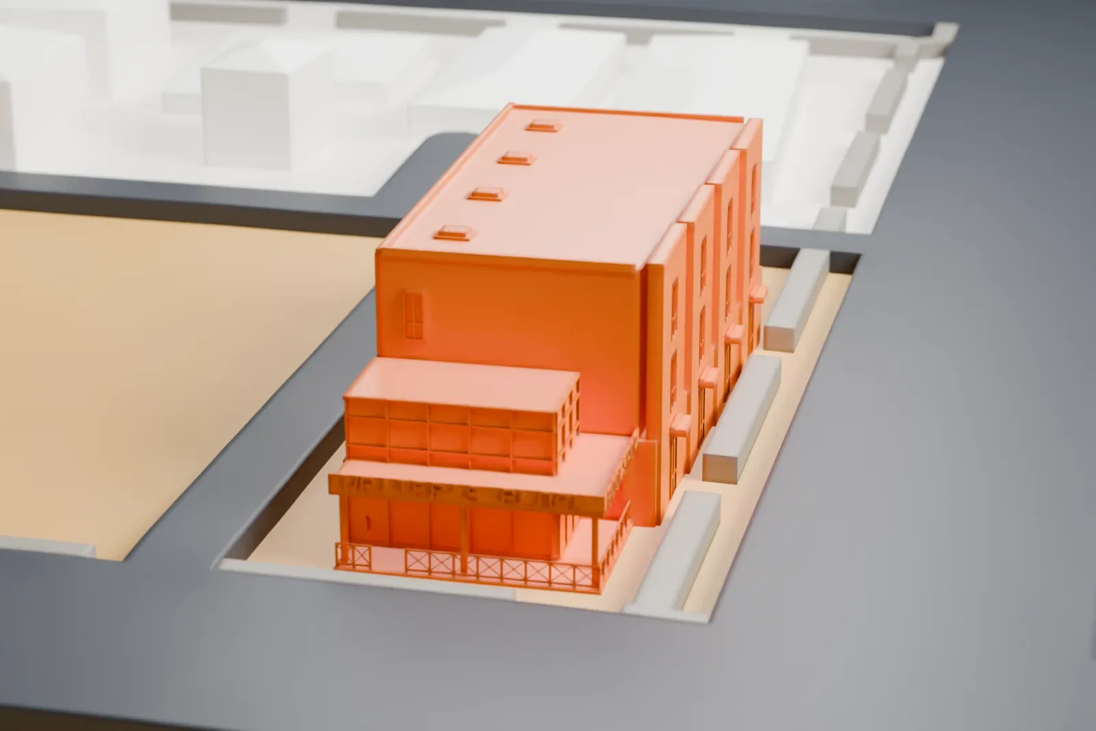 A white 3D print of The Writer's Block, a three-story building with a small corner annex, on a street block with low buildings around it.