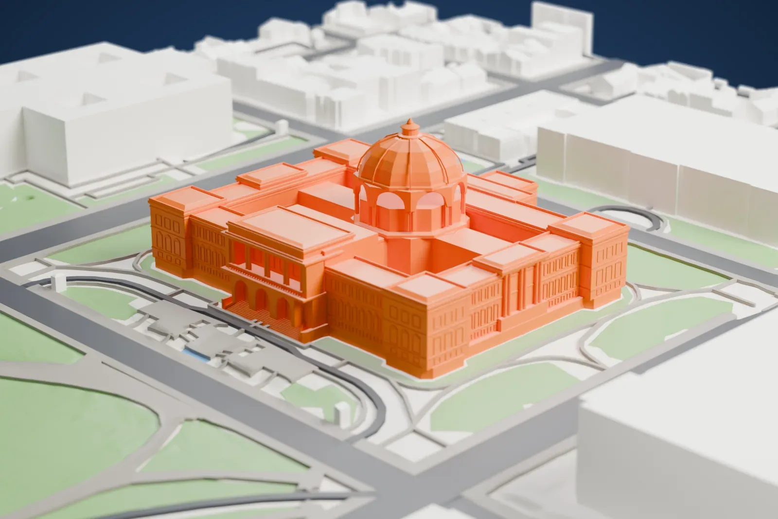 A white 3D print of the Thomas Jefferson Building, a broad building on its city block among the surrounding streets and buildings of Washington, D.C.