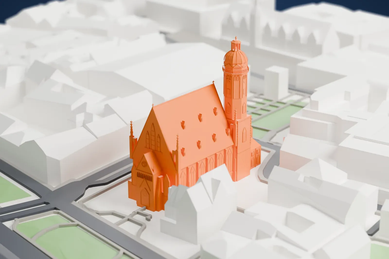 A white 3D print of St. Thomas Church in Leipzig, standing among the surrounding streets and buildings.