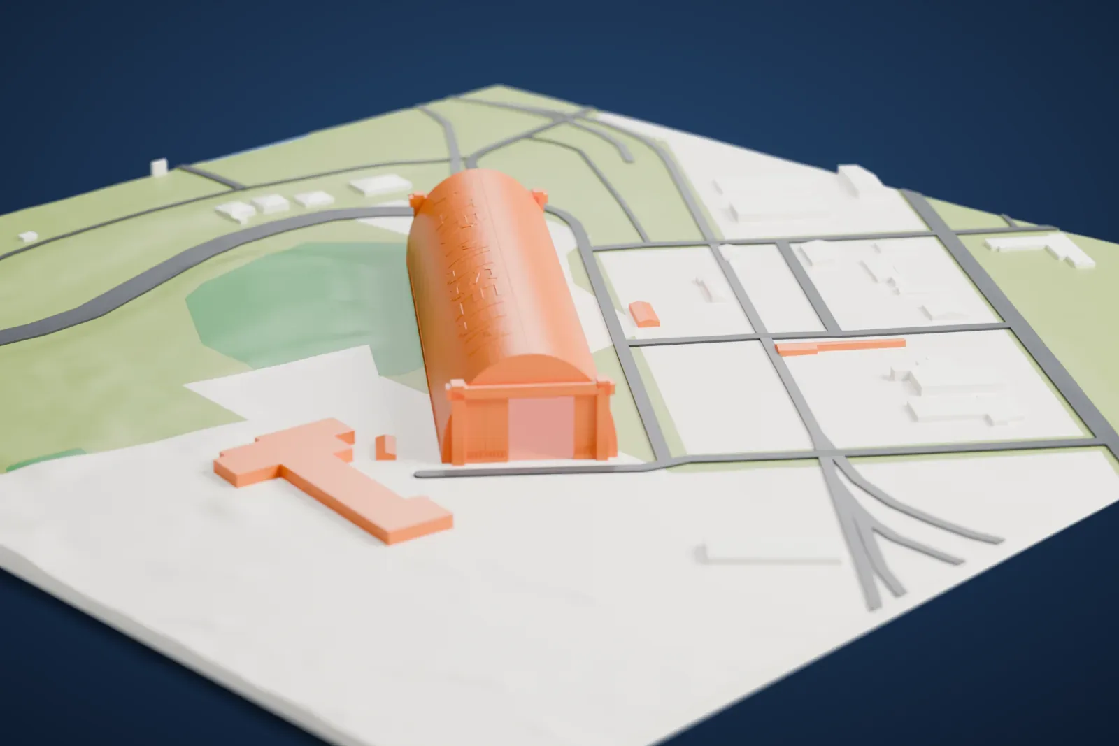 A white 3D print of the Tillamook Air Museum, a very long hangar with a smooth arched roof and AIR MUSEUM lettering, standing among low buildings, roads and green ground.