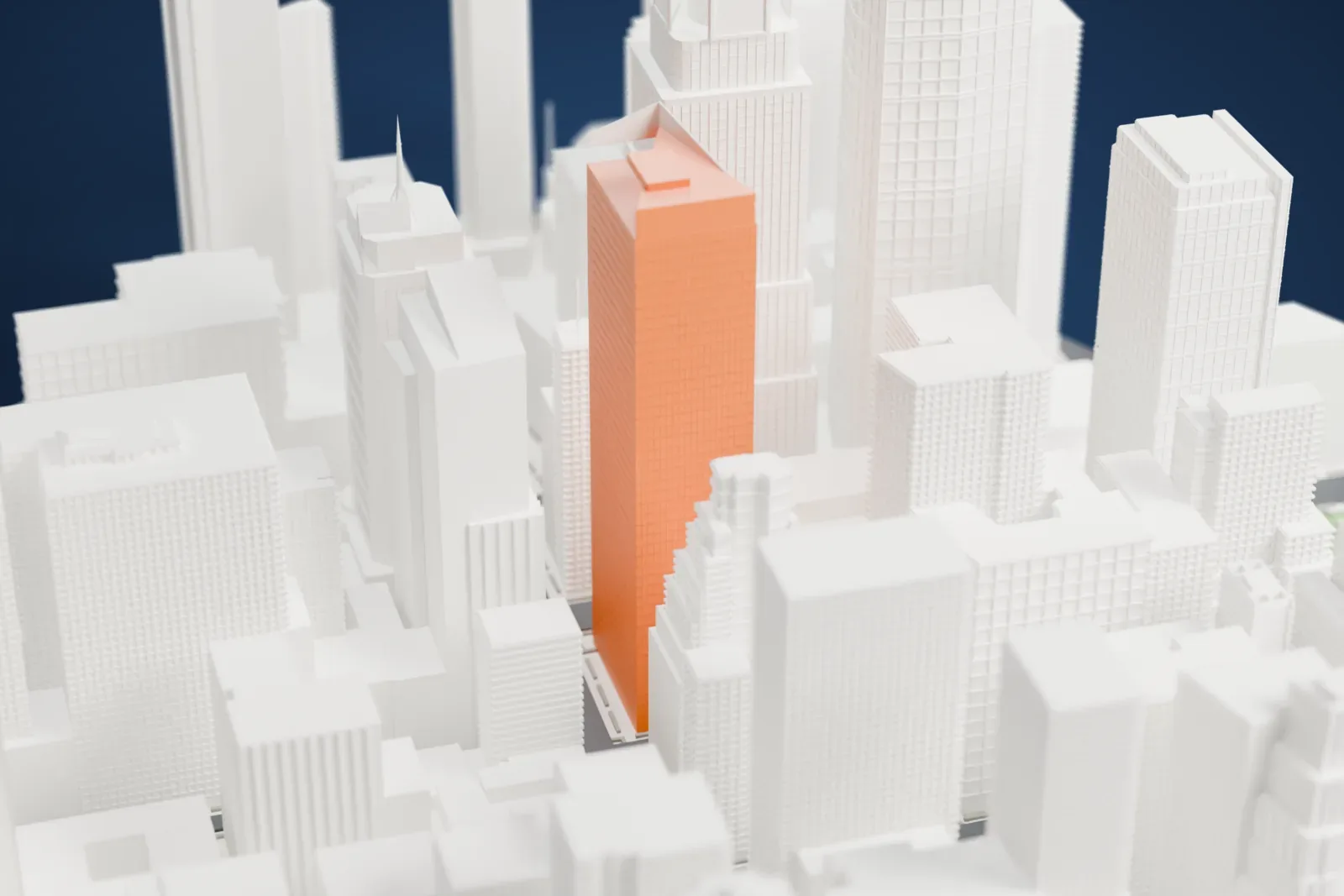 A white 3D print of Times Square Tower, showing its angled crown above a slim tower, surrounded by tightly packed Midtown skyscrapers.