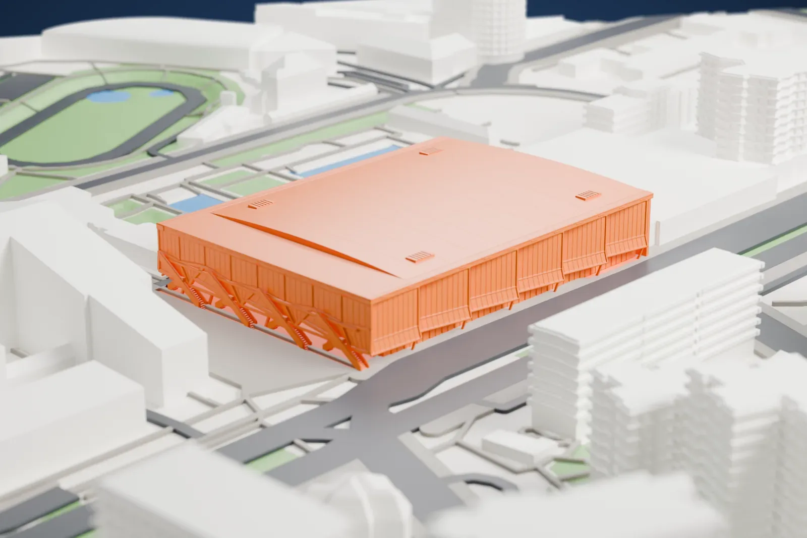 A white 3D print of Tipos Aréna, a broad rectangular hall with a flat roof and a columned front, among surrounding streets and buildings.