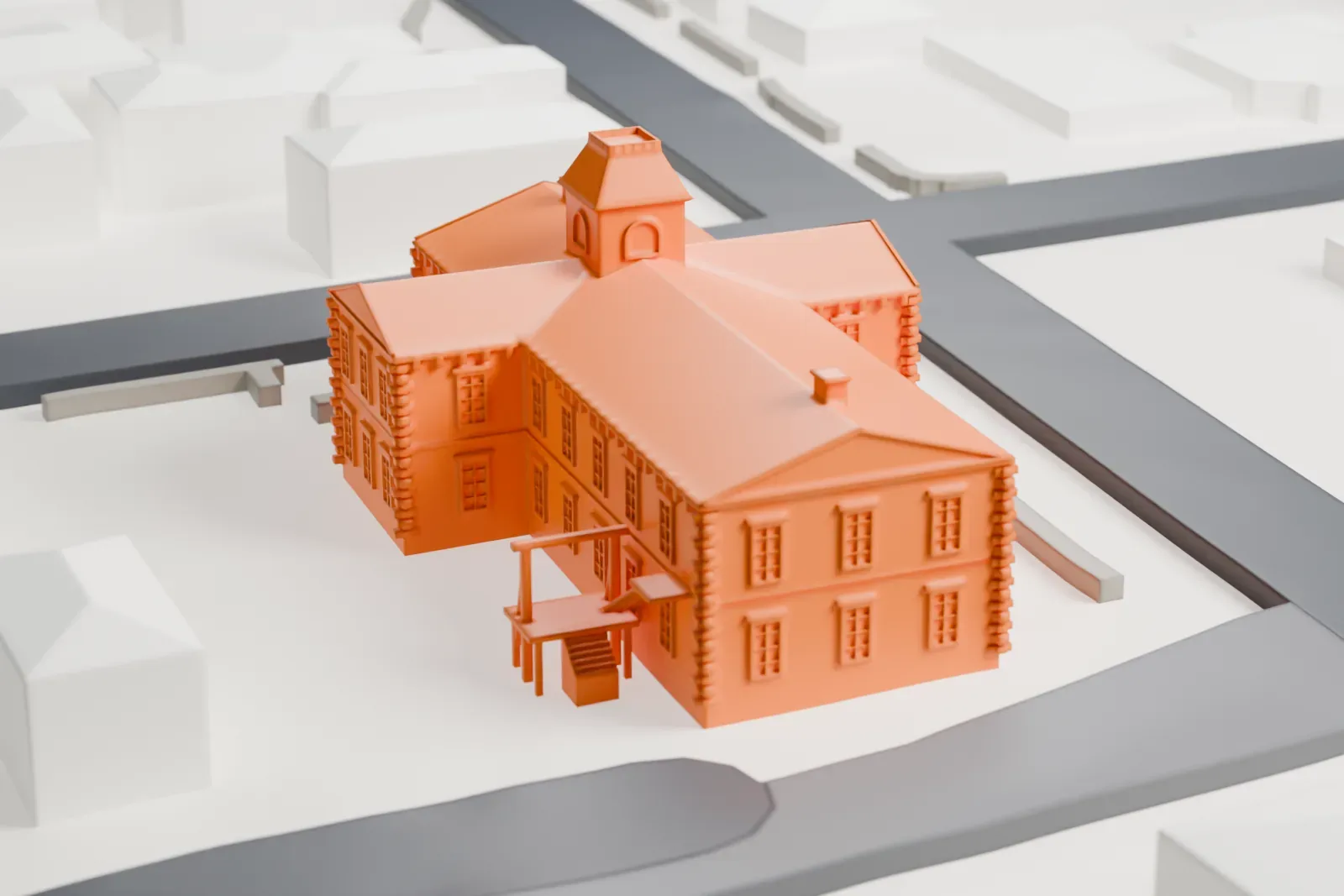 A white 3D print of Tombstone Courthouse, a cross-shaped brick building with a small cupola and a pedimented porch, standing on an open lot with streets and low buildings around it.
