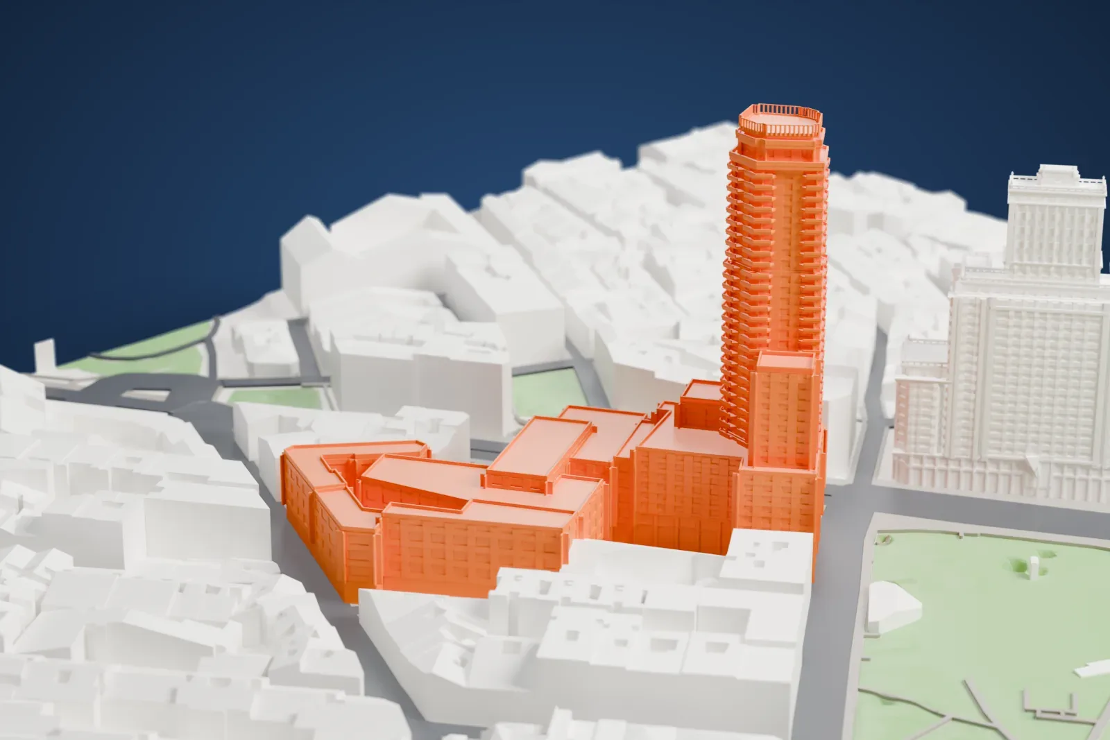 A white 3D print of the Torre de Madrid on Plaza de España, with the surrounding streets and buildings.