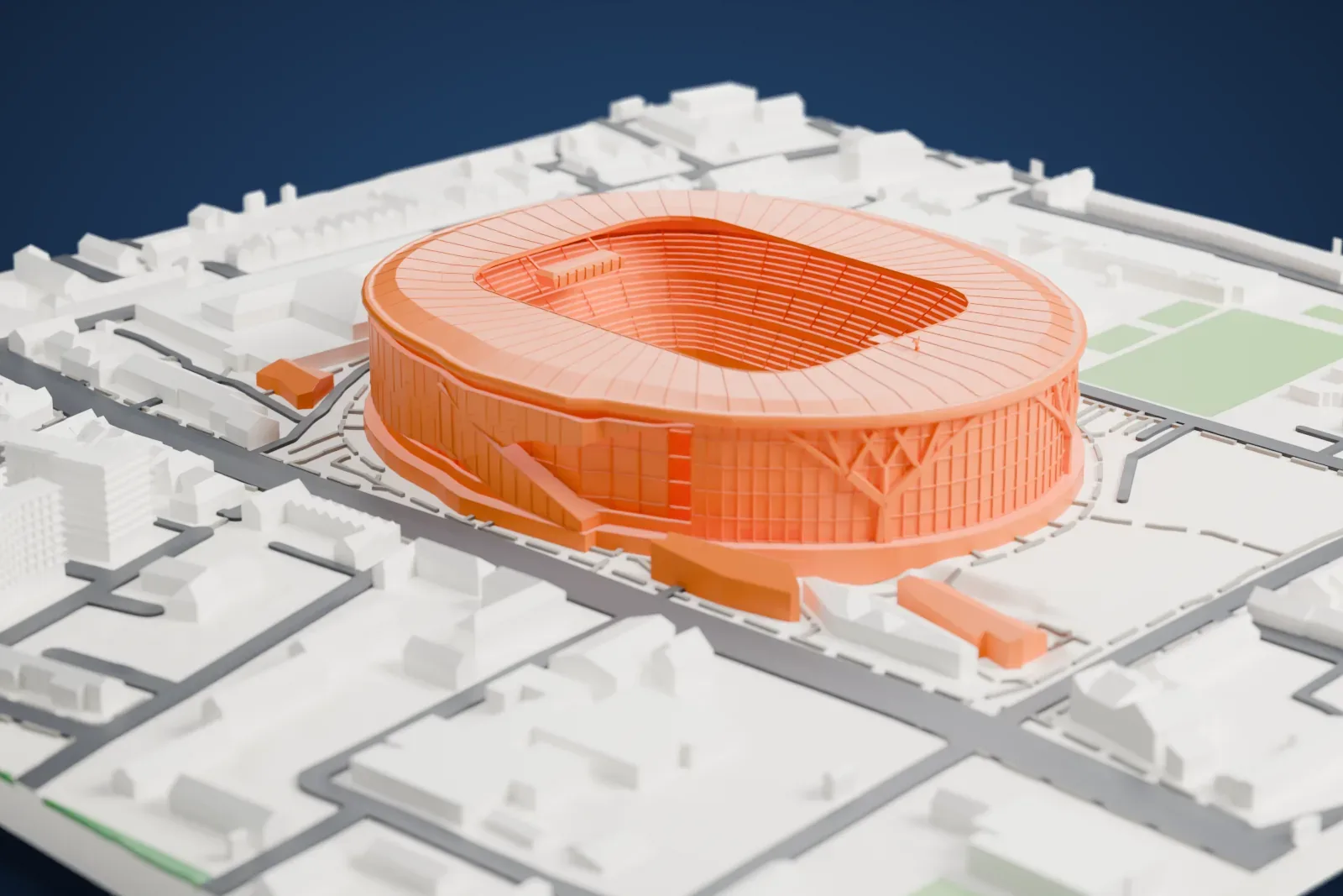 A white 3D print of Tottenham Hotspur Stadium, a large oval stadium with a ribbed roof around an open bowl, surrounded by streets, low buildings and small green spaces.