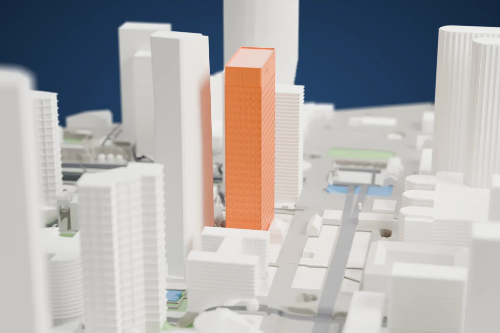 A white 3D print of Tour Ariane, a tall rectangular tower with a boxy crown, among the surrounding towers of La Défense.