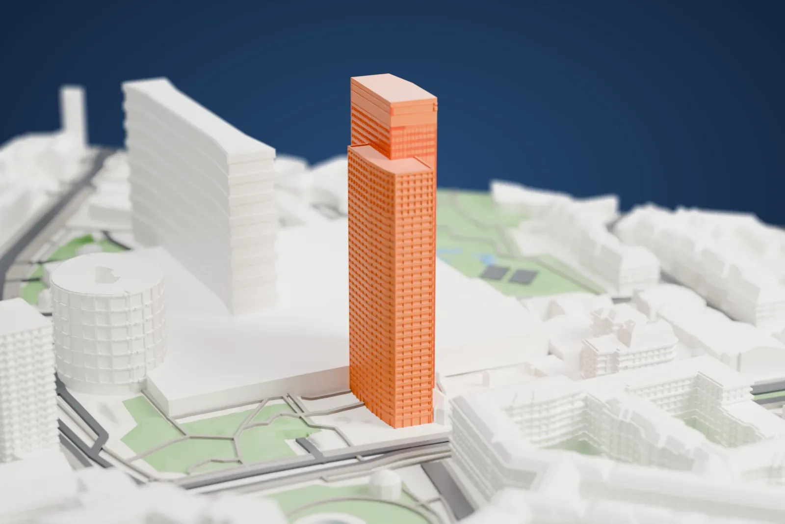 A white 3D print of Tour Les Poissons, a tall tower among surrounding streets and buildings.