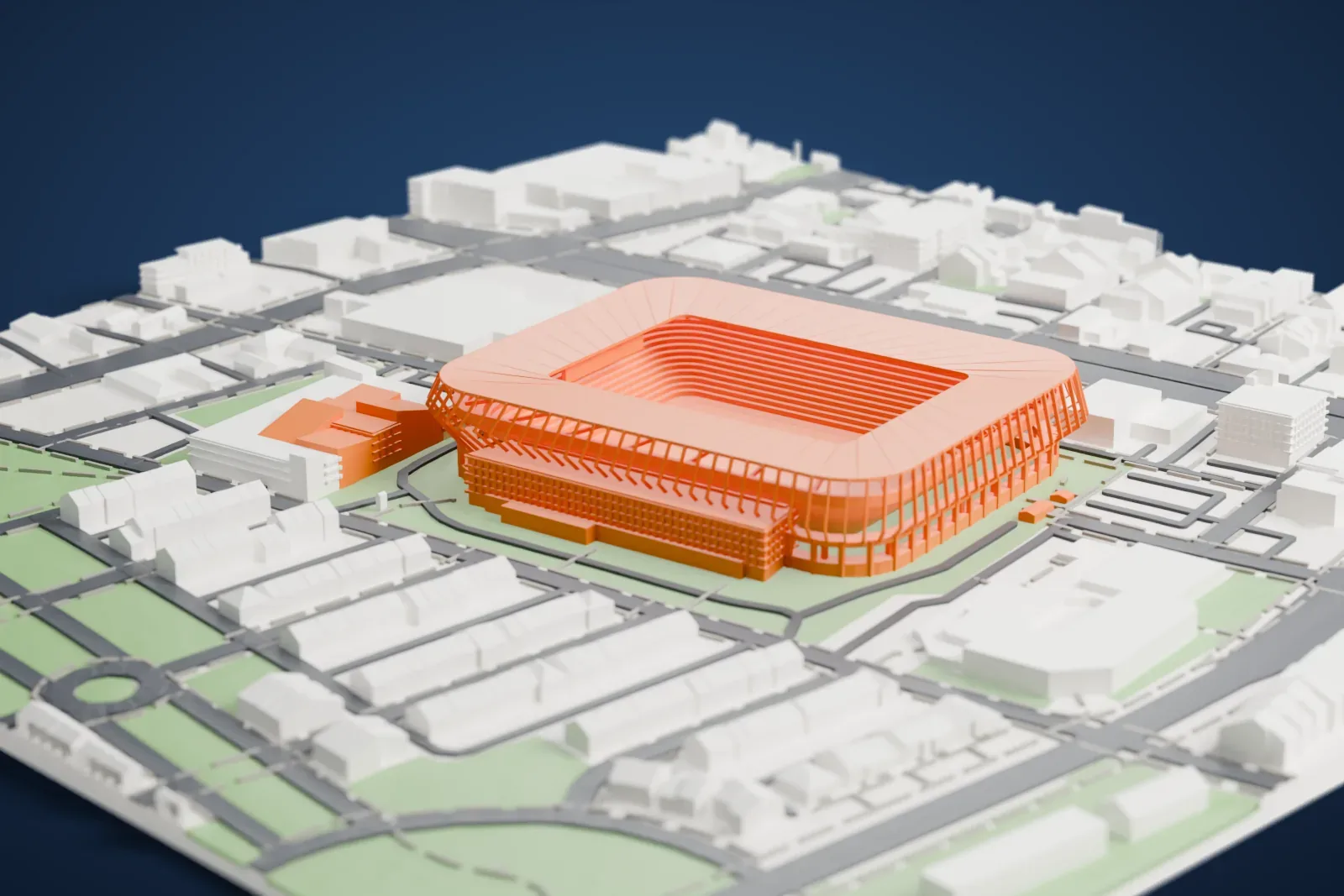 A white 3D print of TQL Stadium, a rounded-rectangle bowl with a roof over all the seating and a ring of slim slanted columns, set among streets and buildings.