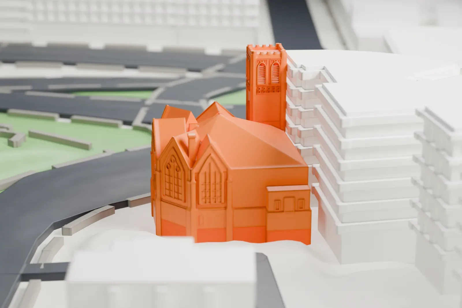 A white 3D print of a church with a tall square corner tower and a high-pitched gabled roof, among taller buildings and streets.