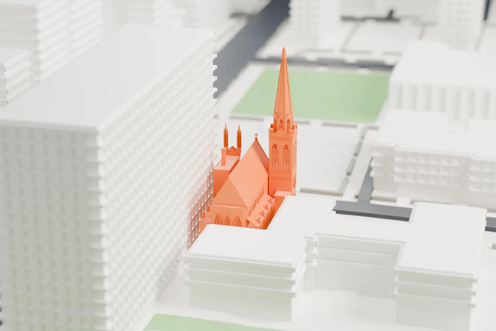 A white 3D print of Trinity Evangelical Lutheran Church, a Gothic-style church with a tall slender spire, beside a green lawn and neighboring buildings.