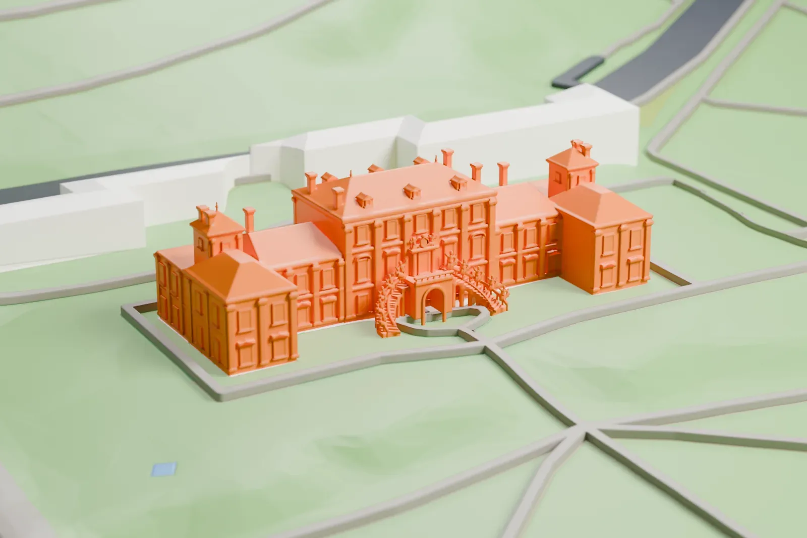 A white 3D print of Troja Palace, a Baroque palace with its gardens, among the surrounding buildings.