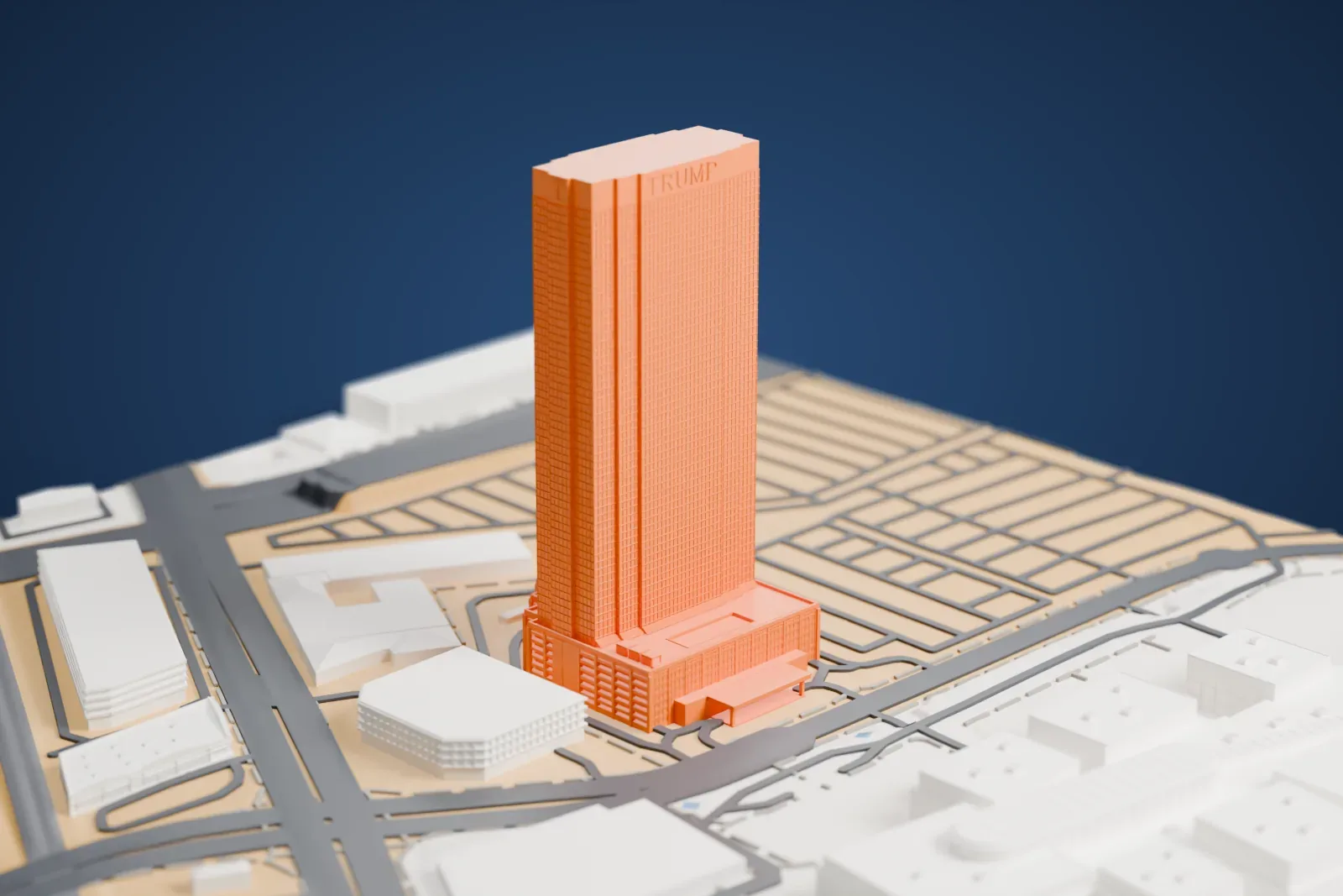 A white 3D print of the Trump International Hotel Las Vegas, a tall slim tower rising from a wider low base, standing among low buildings and a grid of streets.