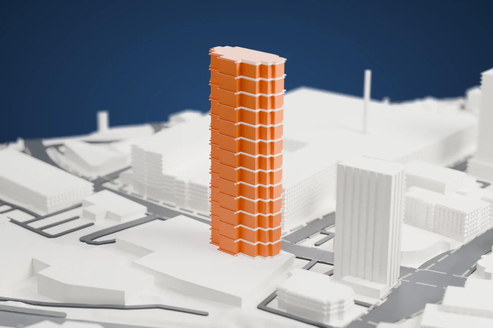 A white 3D print of Trump Plaza New Rochelle, a tall stepped tower with a notched crown rising from a wide, low base, among mid-rise buildings and roads.