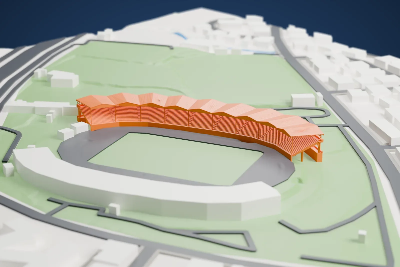 A white 3D print of the Tsirio Stadium, a curved roofed stand beside a pitch and running track, among surrounding streets, buildings and green areas.
