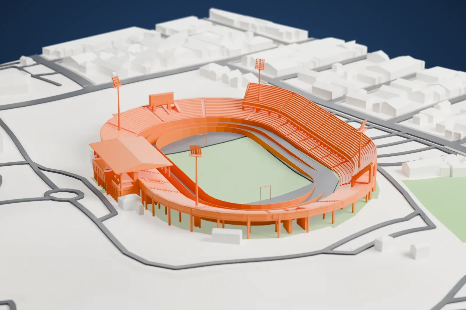 A white 3D print of the Tuanku Abdul Rahman Stadium, an oval stadium with stepped tiers, a canopy over one stand and tall floodlight masts, among surrounding streets and buildings.