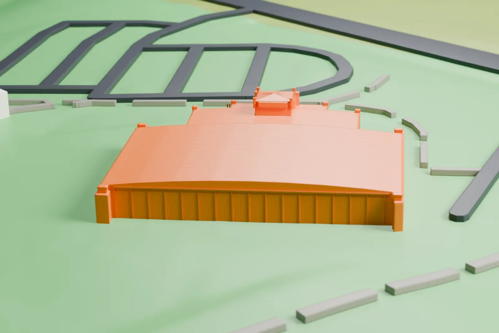 A white 3D print of the Tulsa Air and Space Museum hangar, a large arched-roof hangar with a small entrance block, on open green ground beside roads and paths.