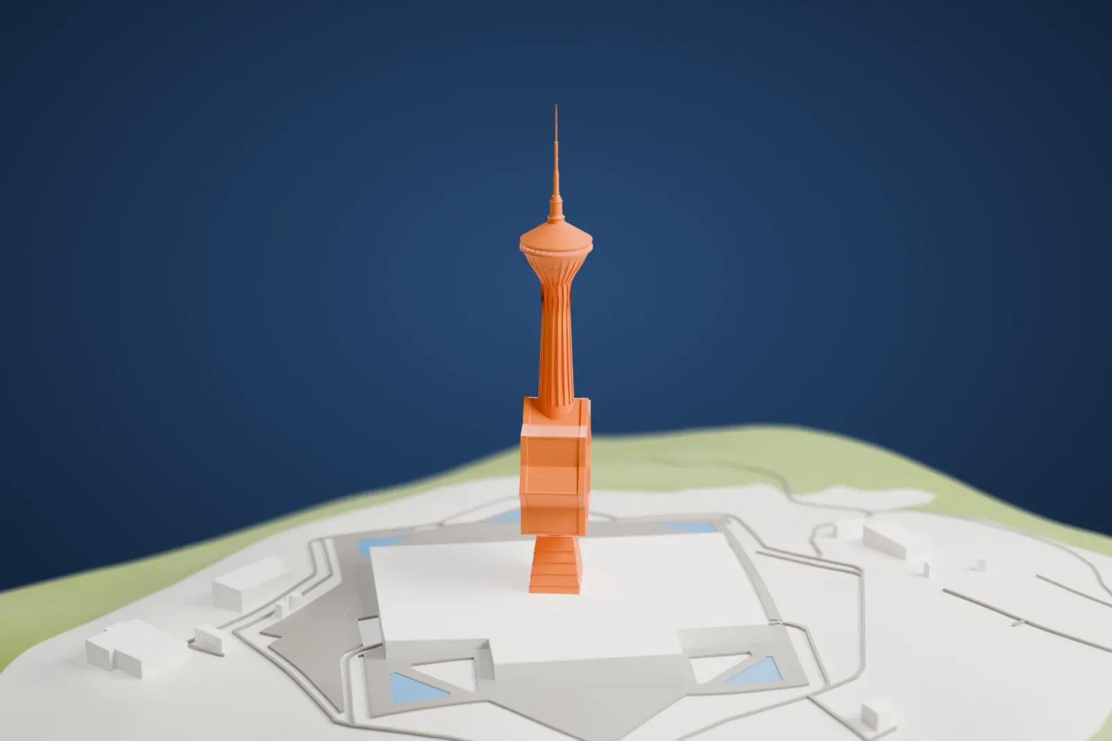 A white 3D print of the Turkmenistan Tower, a slender tower with an eight-pointed star partway up, a round observation deck and a tall mast, with few buildings nearby.