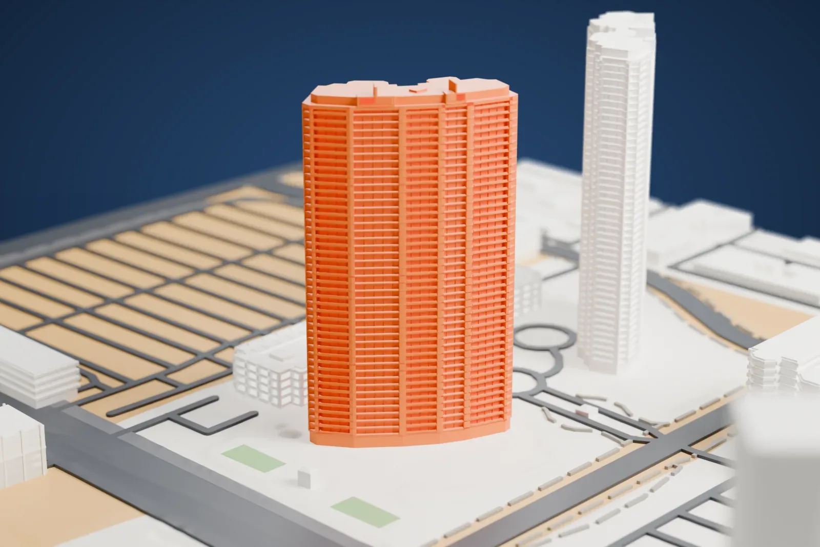 A white 3D print of the twin Turnberry Towers, two tall curved-front towers behind a long low block, among roads and low buildings on a desert-colored ground.