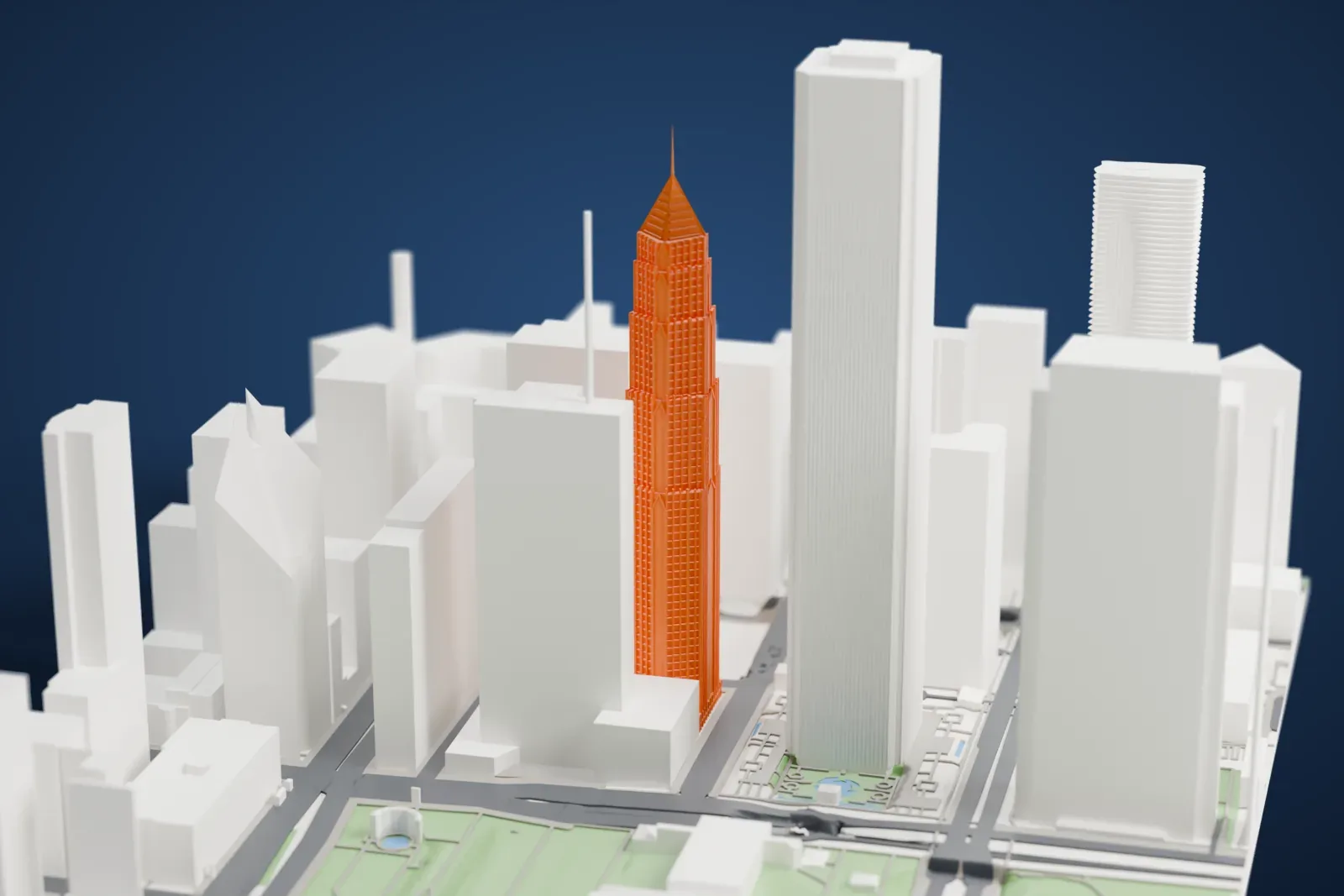 A white 3D print of Two Prudential Plaza rising above the surrounding buildings of Chicago's Loop.