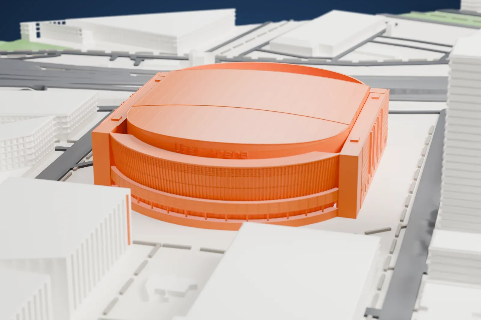 A white 3D print of Uber Arena, a wide oval arena with a shallow roof and a curved facade, surrounded by large buildings and roads.