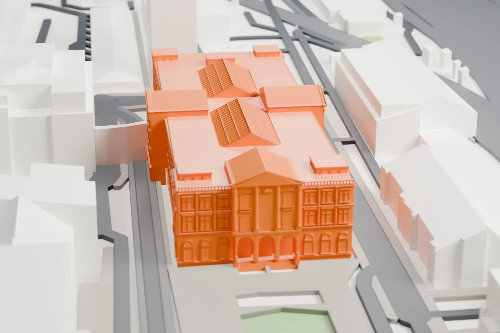 A white 3D print of the Übersee-Museum, a museum building among surrounding city streets and buildings.