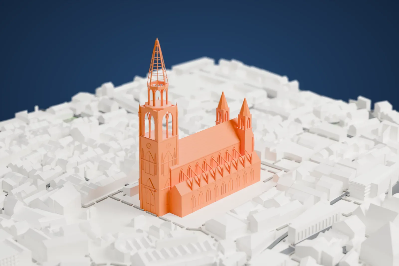 A white 3D print of Ulm Minster, a long Gothic church with a tall open-work spire at one end, surrounded by closely packed buildings and narrow streets.