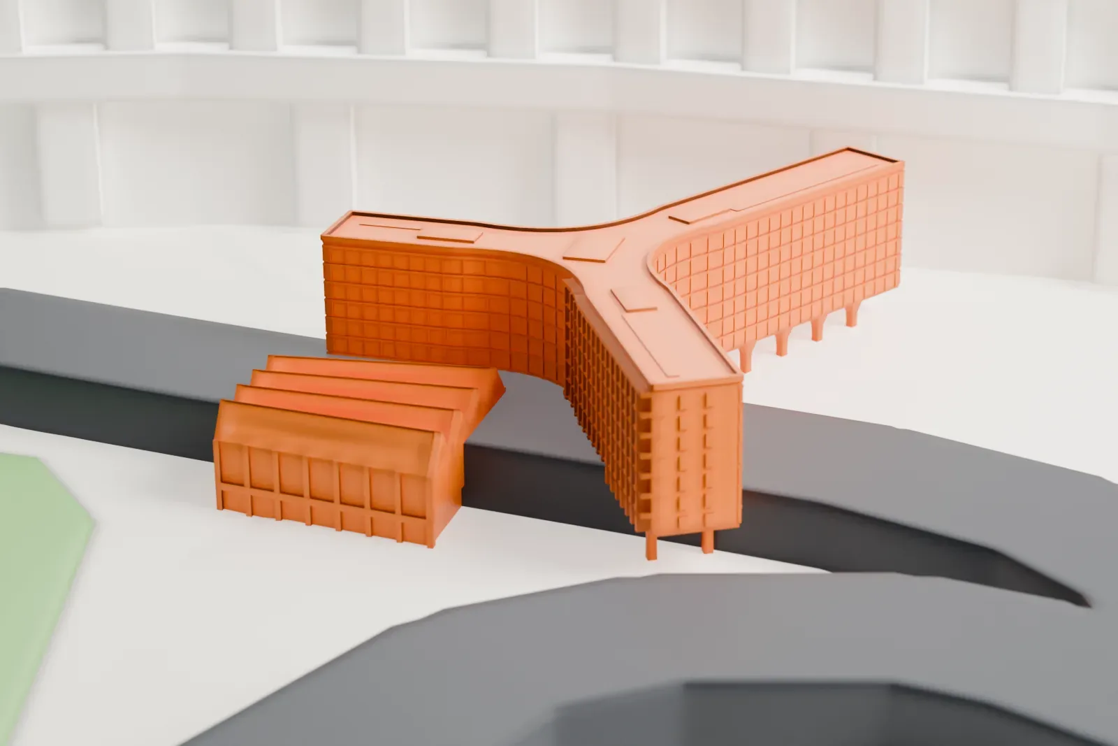 A white 3D print of the UNESCO Headquarters among the surrounding streets and buildings.
