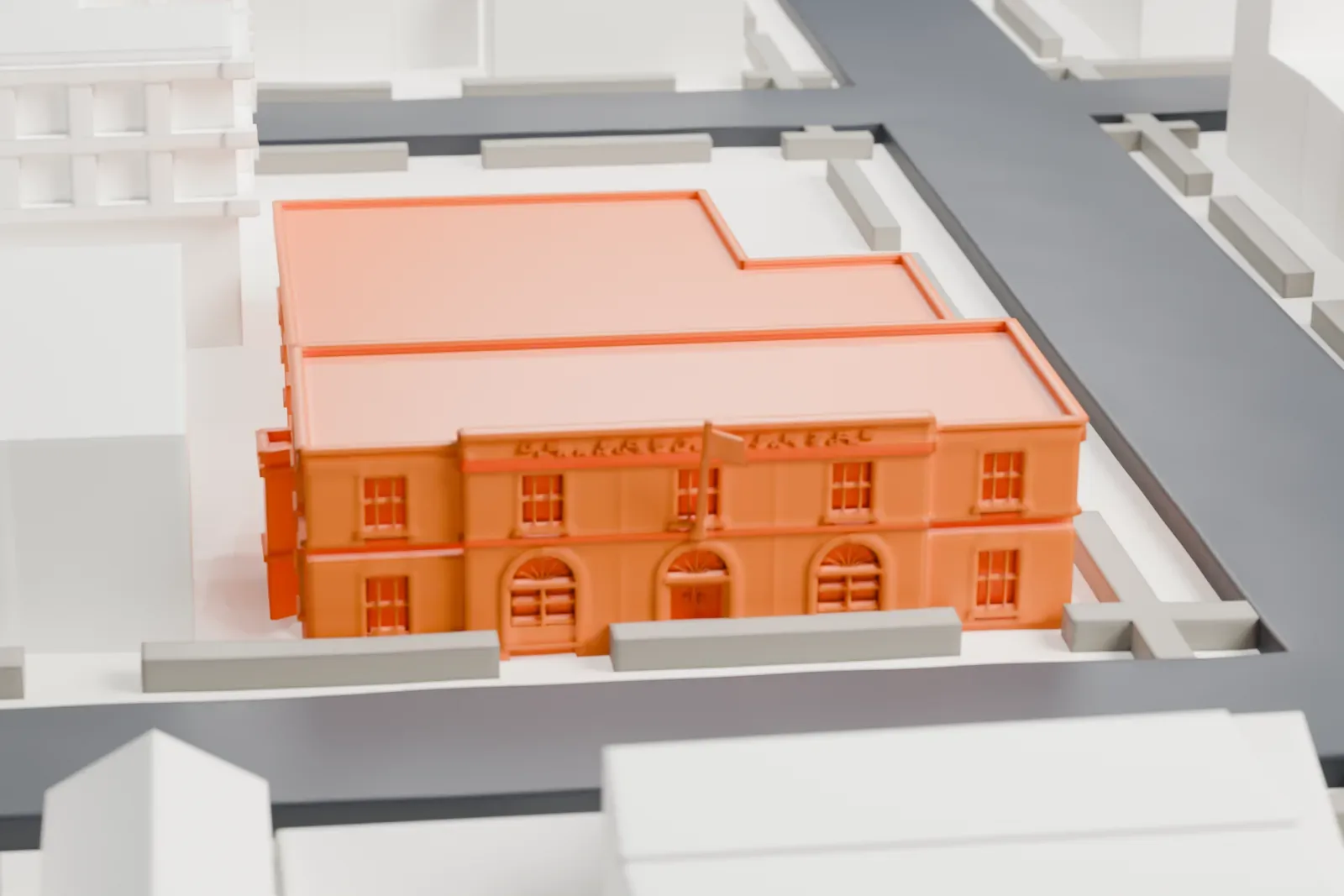 A white 3D print of the Bensonhurst post office, a two-story flat-roofed building with a lower wing, among larger buildings and streets.