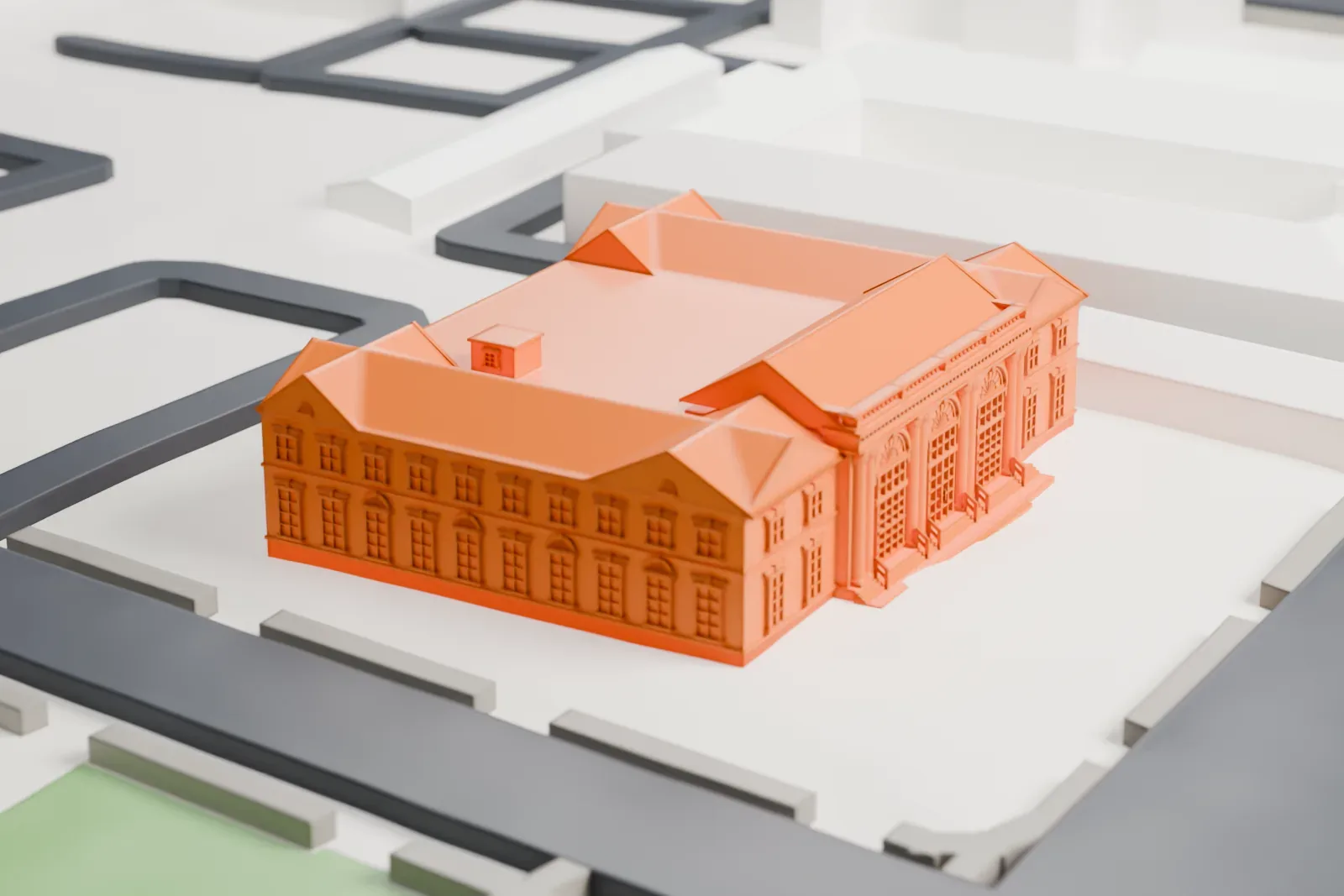 A white 3D print of the Freeport post office, a two-story building with hipped roof corners and a columned entrance pavilion, standing on its own lot among streets.