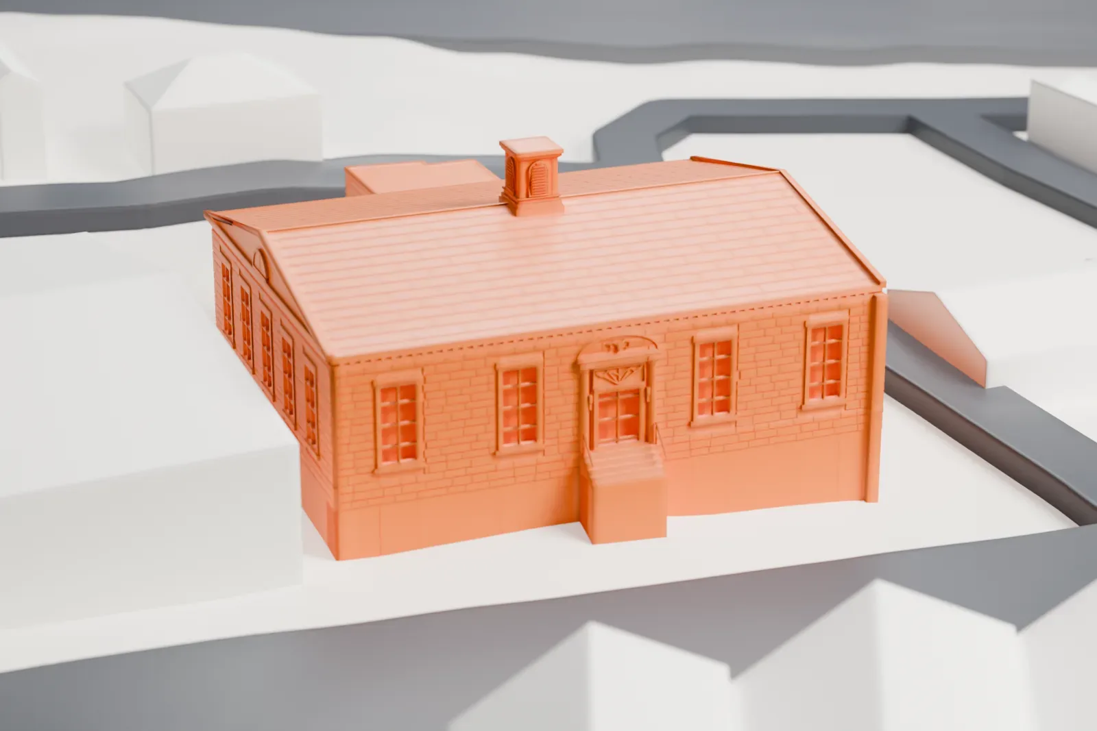 A white 3D print of the Harrison post office, a one-story building with a hipped roof and a small cupola, standing on its own lot between streets.