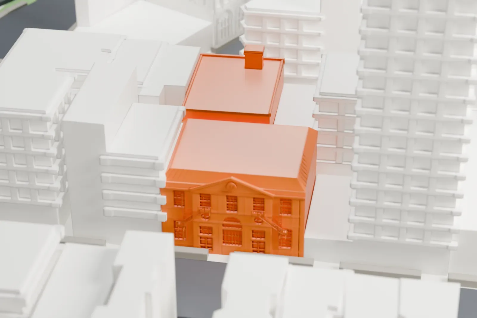 A white 3D print of the Knickerbocker Station post office, a small building among dense blocks of taller buildings, with a park and streets nearby.