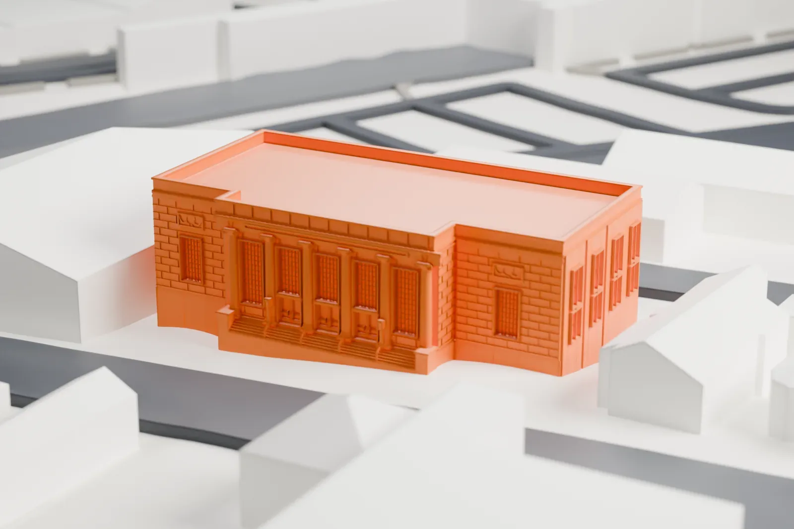 A white 3D print of the Mount Vernon post office, a boxy flat-roofed building with a columned entrance, surrounded by smaller houses and nearby streets.