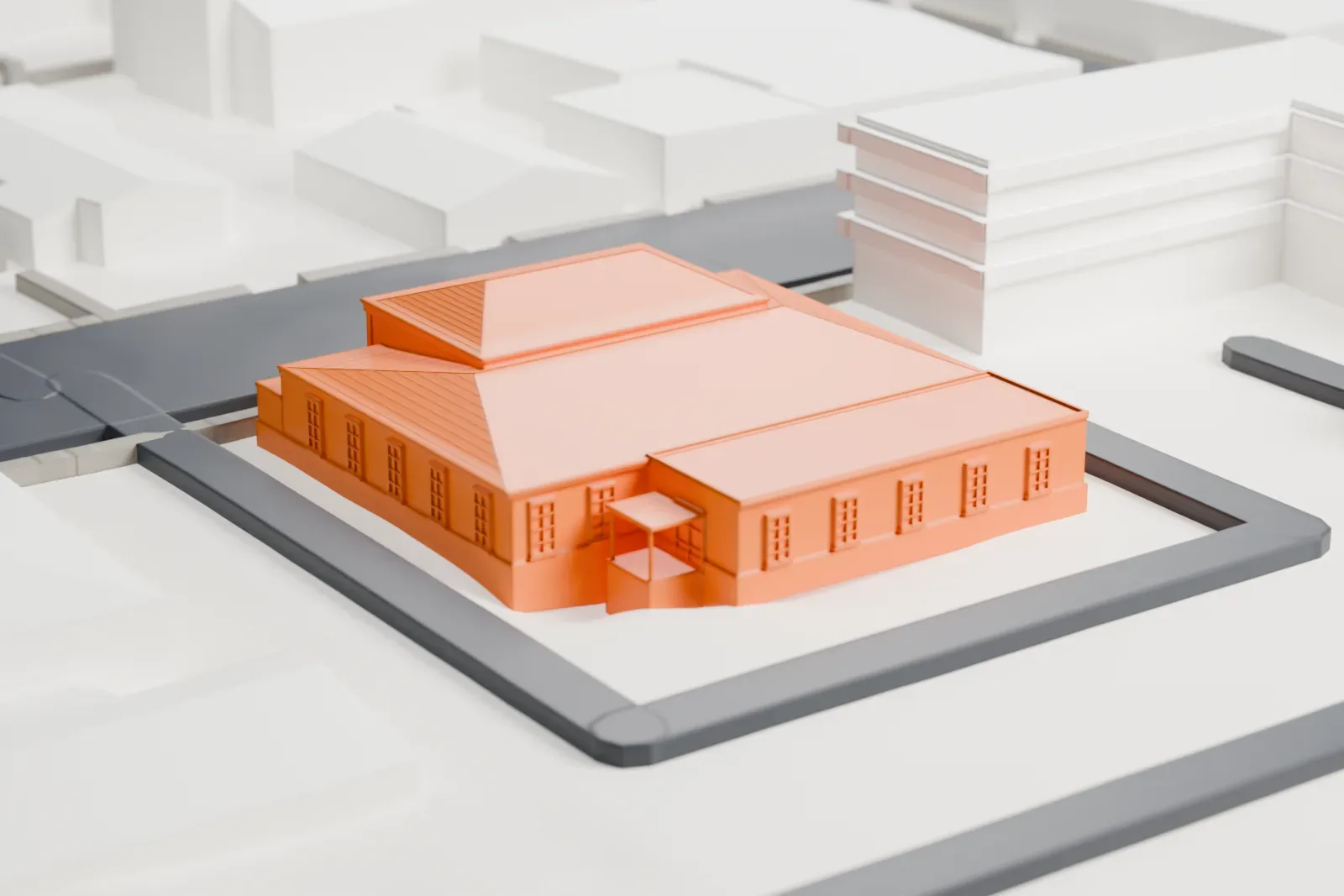 A white 3D print of a one-story post office with a hipped roof, set on a block surrounded by streets and nearby buildings.