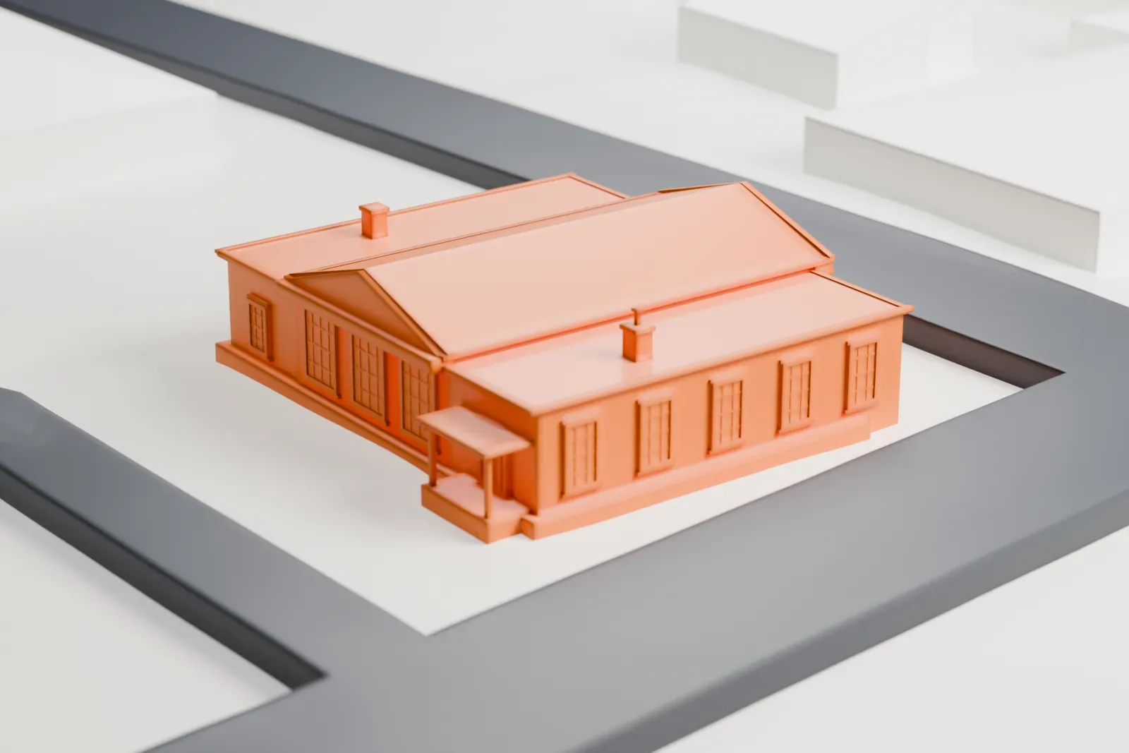 A white 3D print of the Spring Valley post office, a low building with a pedimented front and flat-roofed wings, on a lot between streets.