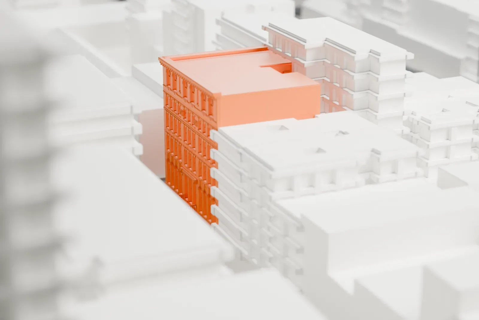 A white 3D print of the University Settlement building, a small building tucked among dense Lower East Side blocks with a green park nearby.
