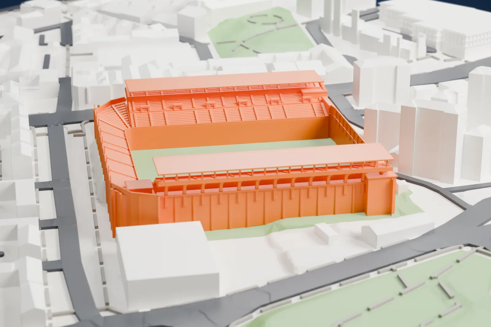 A white 3D print of the Vallecas Stadium, with two long roofed side stands, a low single-tier stand curving round one end and an advertising wall at the other, among surrounding streets and buildings.