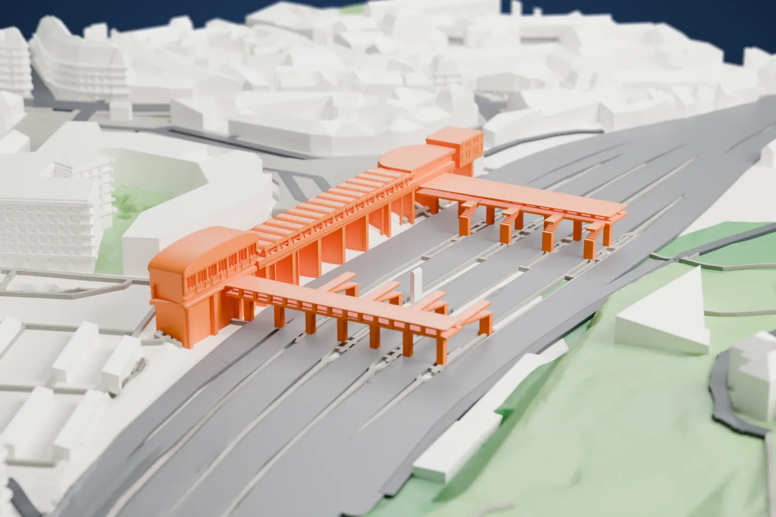 A white 3D print of Versailles Chantiers station, a railway station, among the surrounding streets and buildings.