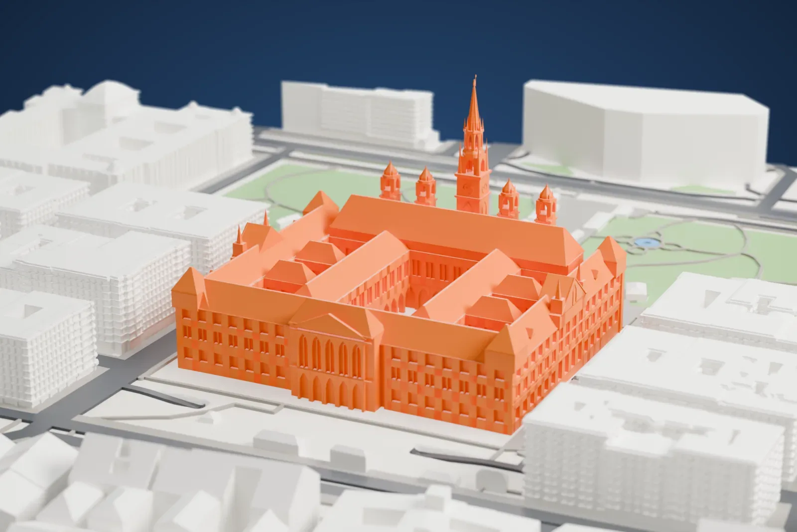 A white 3D print of Vienna City Hall, with the surrounding streets and buildings around it.