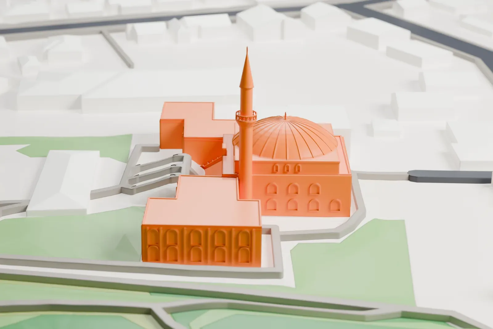 A white 3D print of the Vienna Islamic Centre, with its dome and minaret rising among the streets and buildings of Floridsdorf.