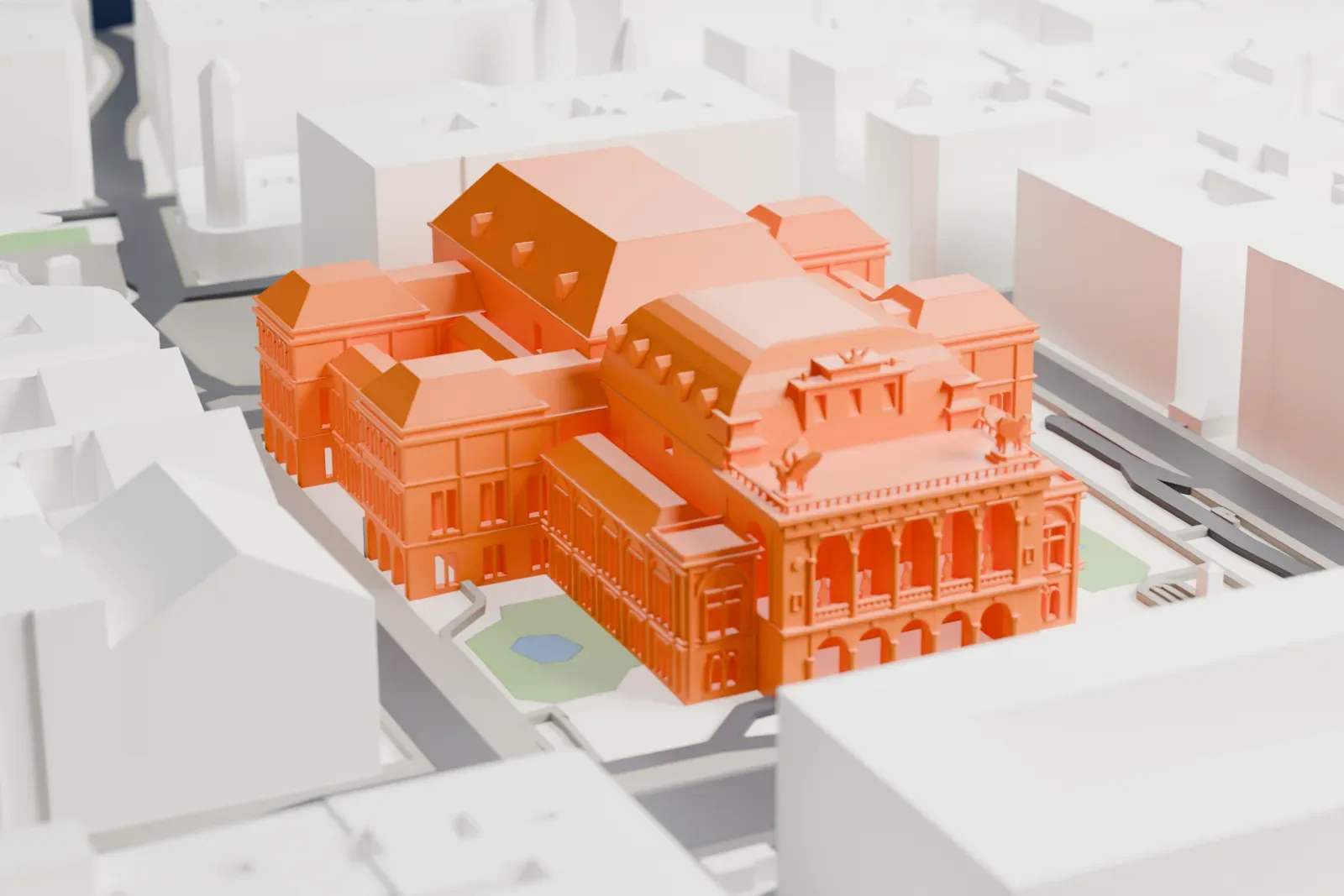 A white 3D print of the Vienna State Opera, a long ornate block standing among city streets and buildings.