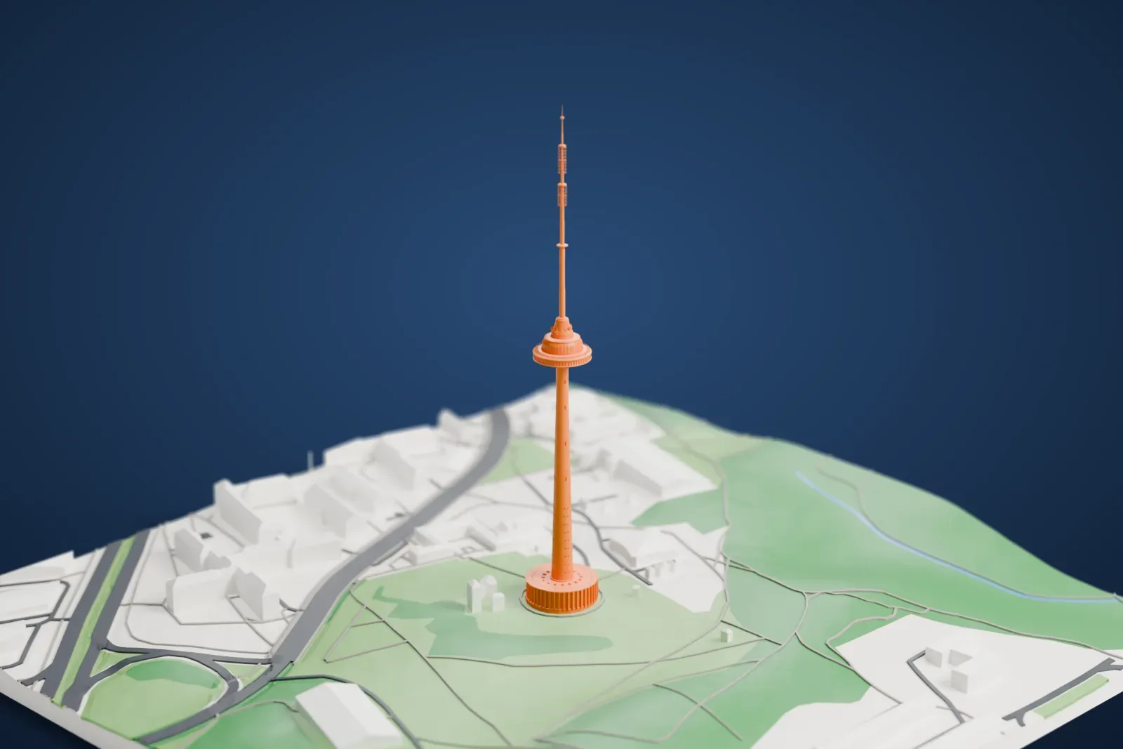 A white 3D print of the Vilnius TV Tower, its tapered shaft and saucer rising from a round base, among surrounding buildings.