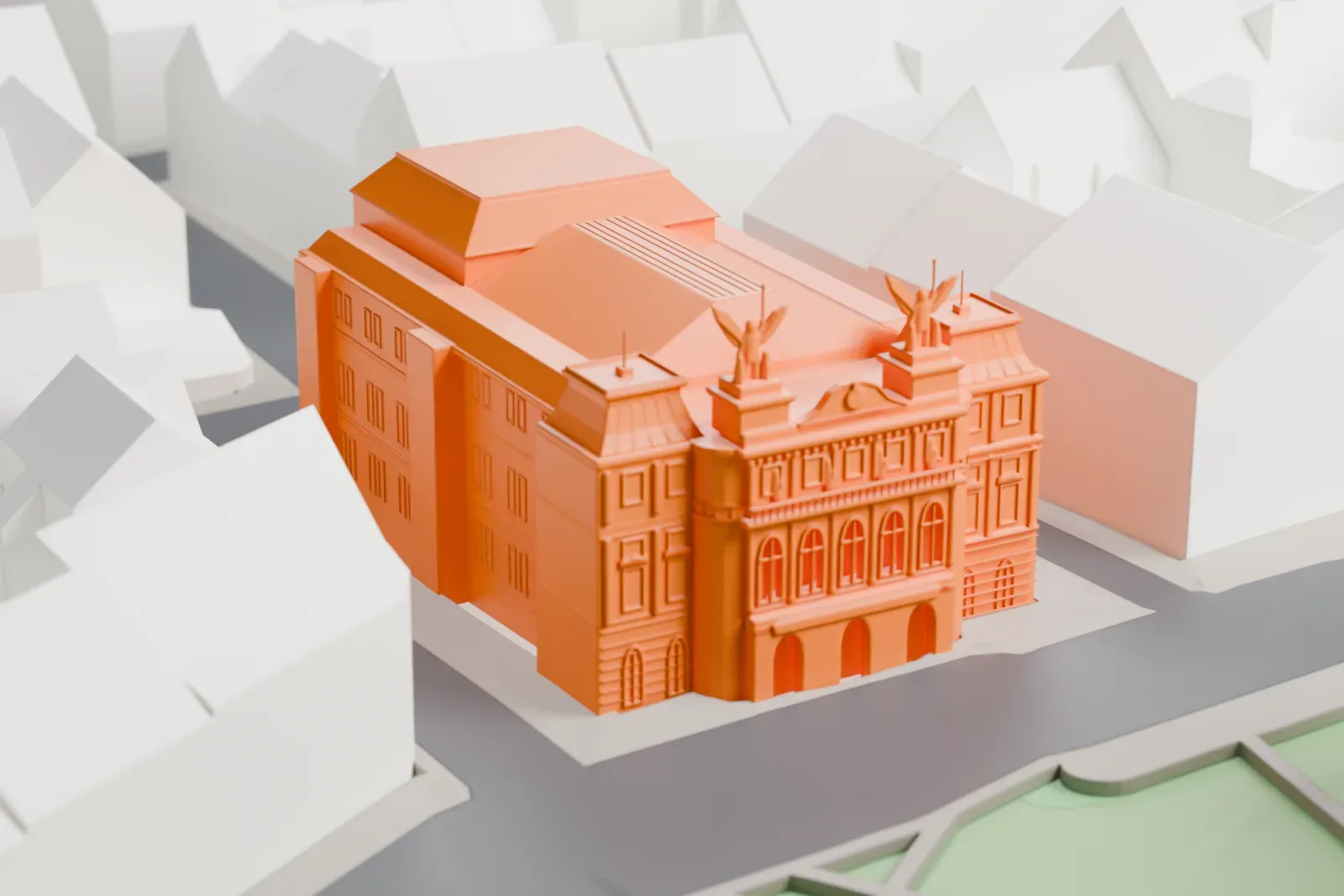 A white 3D print of the Vinohrady Theatre among surrounding streets and buildings.