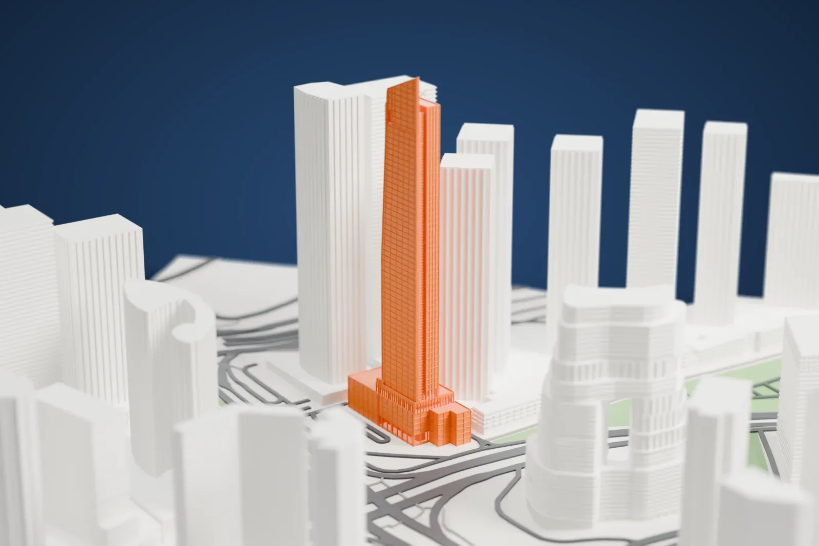 A white 3D print of the Vision Tower standing among the surrounding streets and buildings.