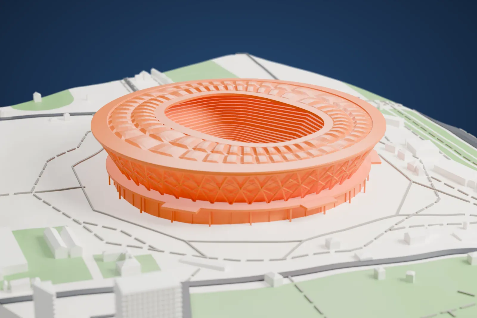 A white 3D print of the Volgograd Arena, a drum that widens toward the top under a diagonal lattice, crowned by a ring roof of cushioned bays, among the streets and buildings around it.