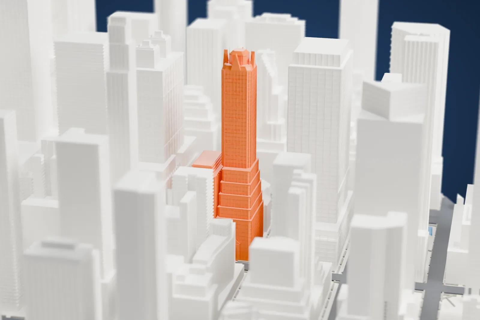 A white 3D print of the Waldorf Astoria New York, a tall tower with two small stepped towers on its roof, packed in among other tall buildings.