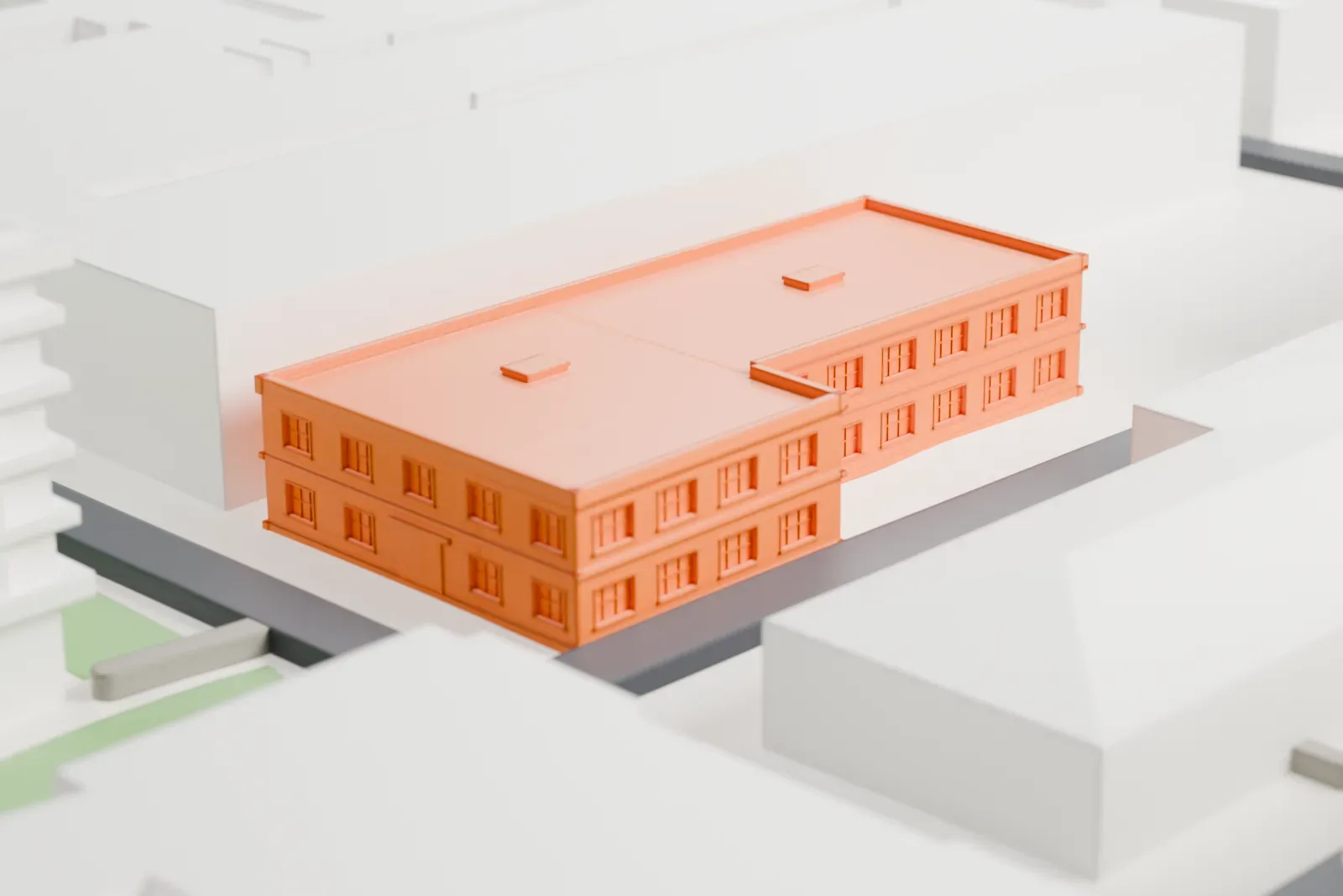 A white 3D print of the Walt Disney Studios lot, a cluster of studio buildings, among the surrounding streets and buildings.